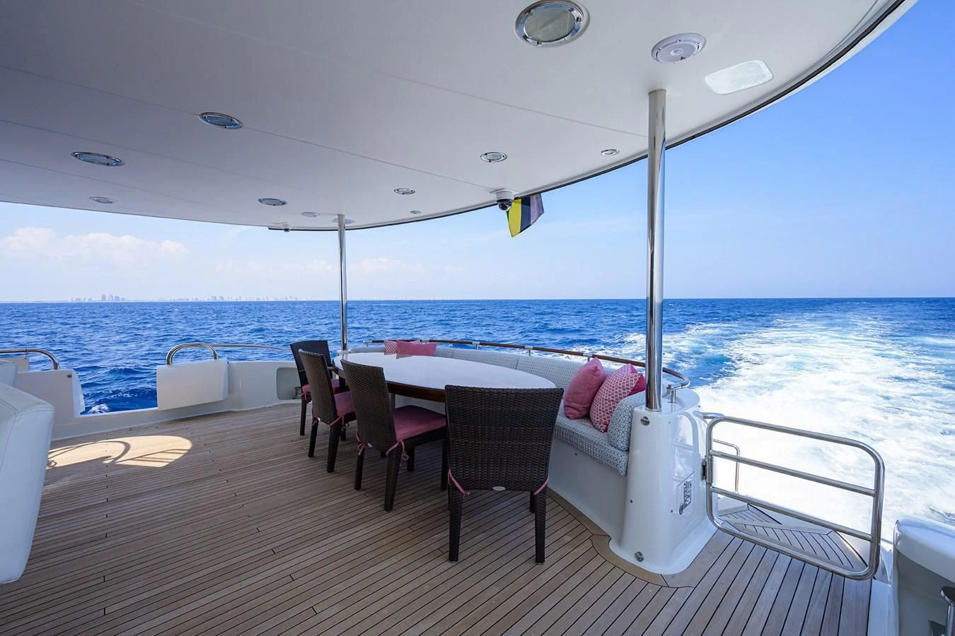 a deck with chairs and tables on it aboard THE JOB FATHER Yacht for Sale