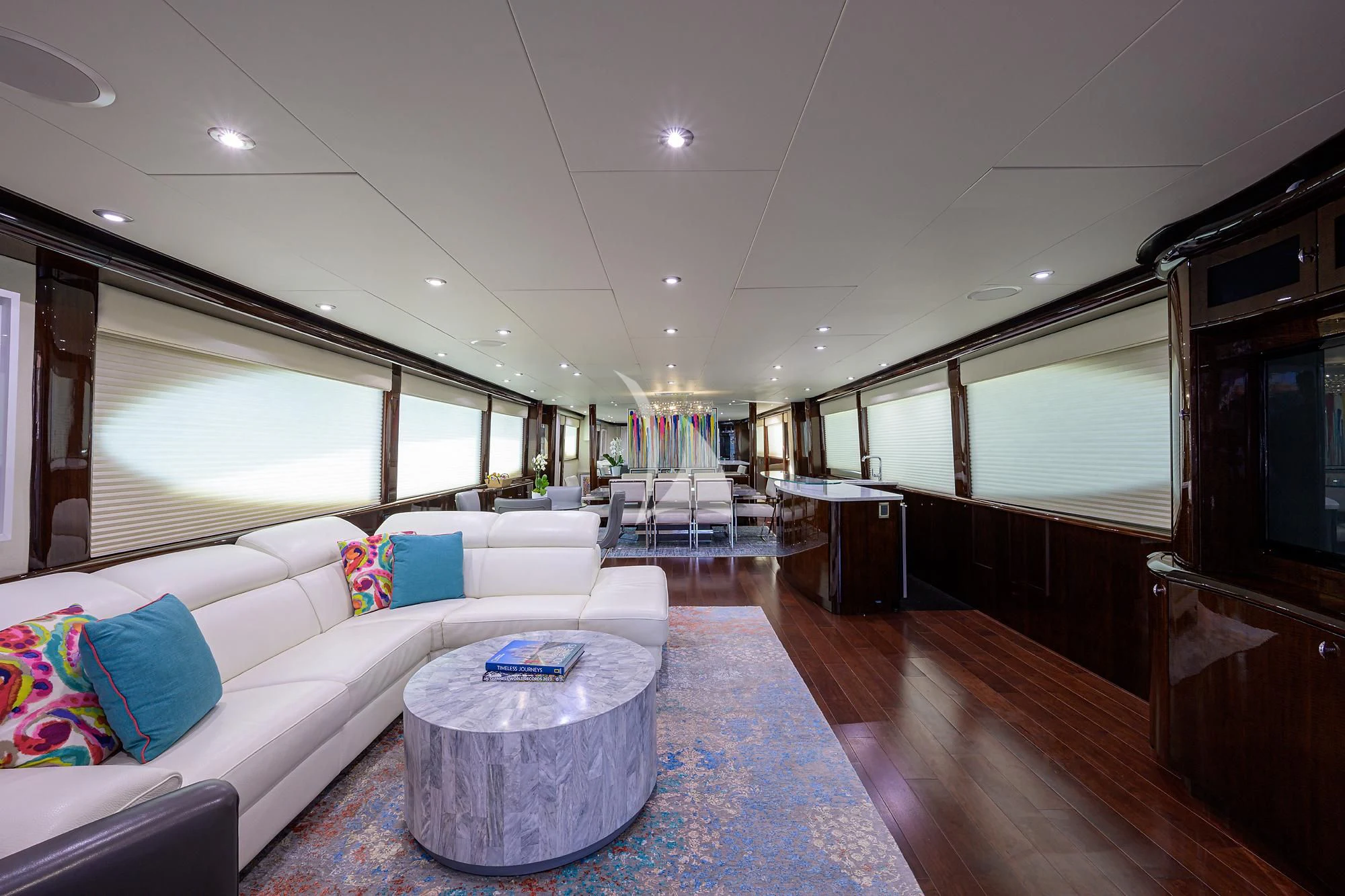 a living room with a large window aboard THE JOB FATHER Yacht for Sale