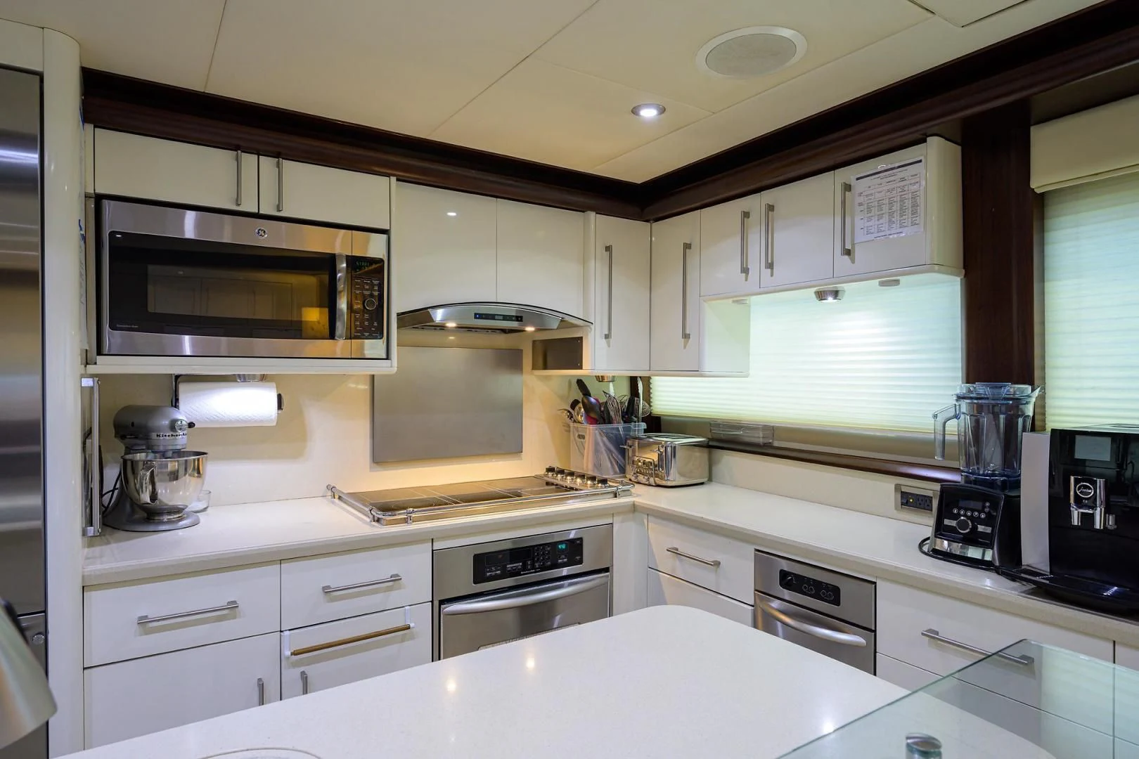 a kitchen with white cabinets aboard THE JOB FATHER Yacht for Sale