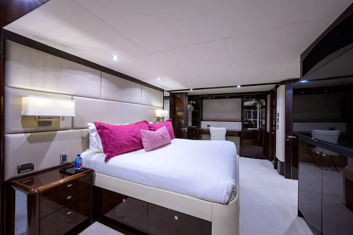 a bedroom with a bed and a desk aboard THE JOB FATHER Yacht for Sale