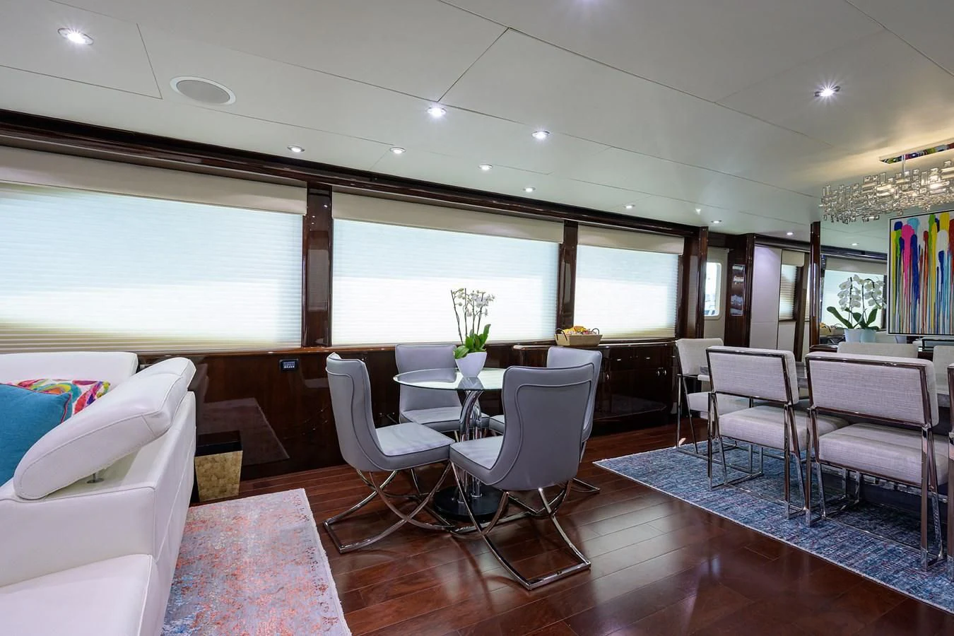 a room with a table chairs and a couch aboard THE JOB FATHER Yacht for Sale