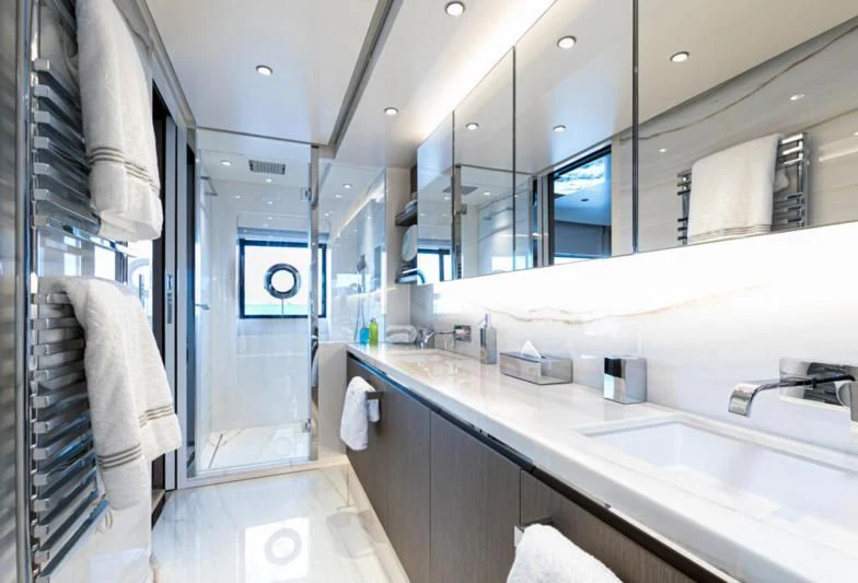 a bathroom with a large mirror aboard JAG'B Yacht for Sale