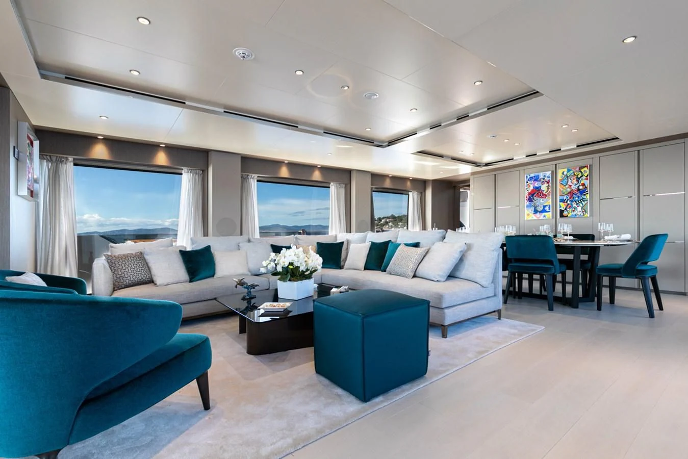 a living room with a couch and a table aboard JAG'B Yacht for Sale