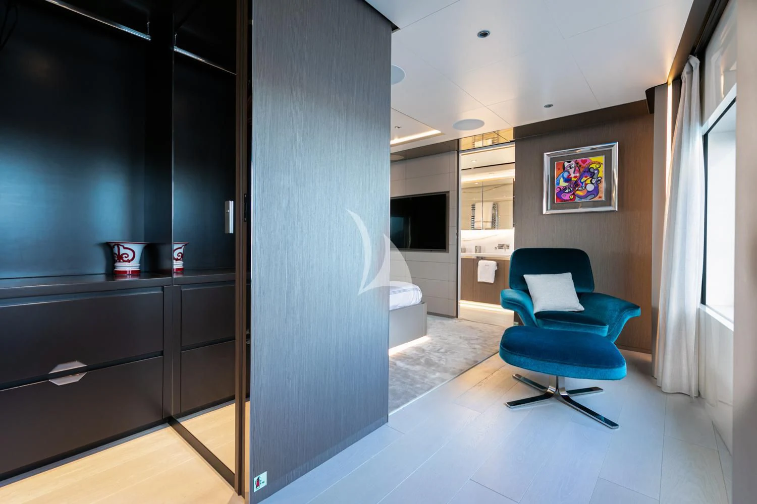 a room with a blue chair and a blue chair aboard JAG'B Yacht for Sale