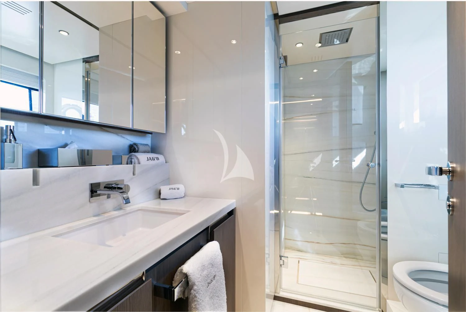 a bathroom with a glass shower door aboard JAG'B Yacht for Sale