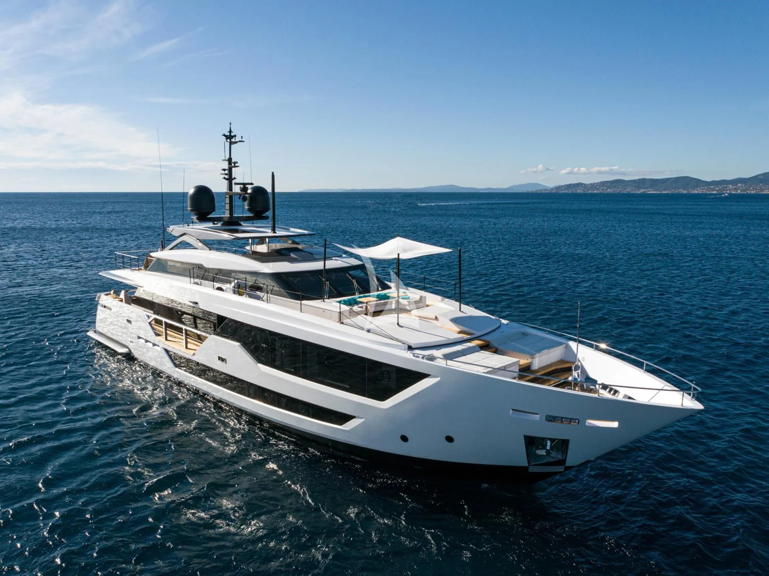a white boat in the water aboard JAG'B Yacht for Sale