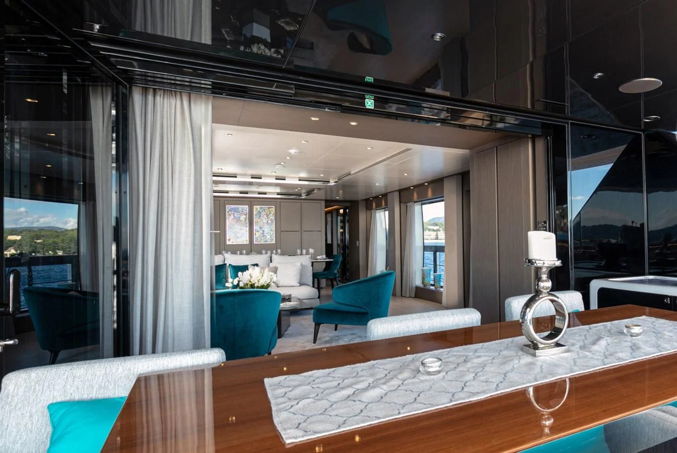 a large room with a table and chairs aboard JAG'B Yacht for Sale