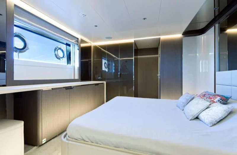 a room with a bed and a window aboard JAG'B Yacht for Sale