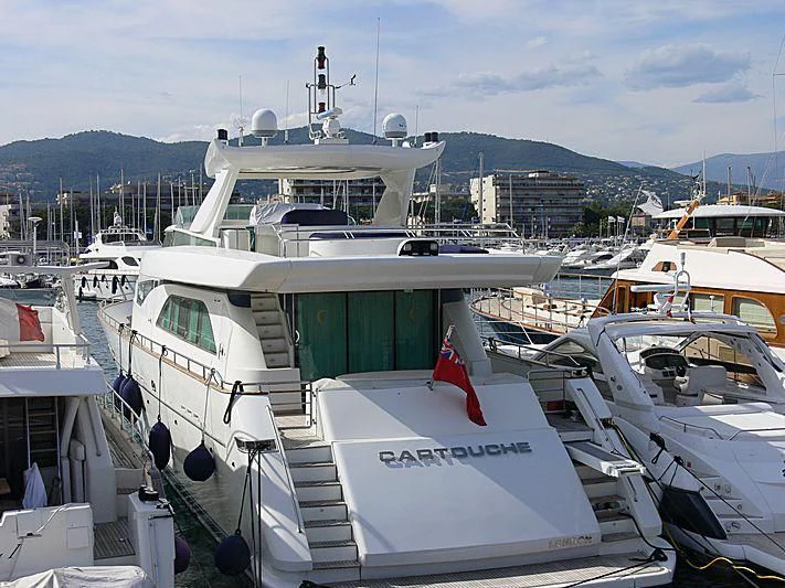 a group of boats are parked in a harbor aboard CARTOUCHE Yacht for Sale
