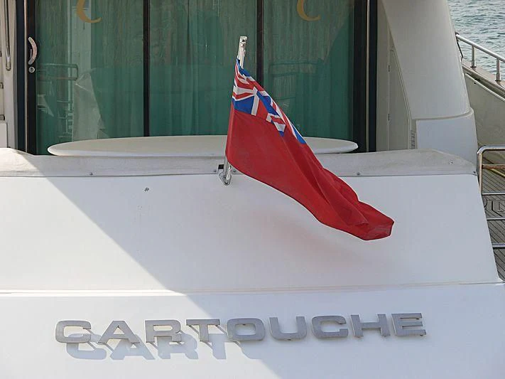 a flag on a boat aboard CARTOUCHE Yacht for Sale