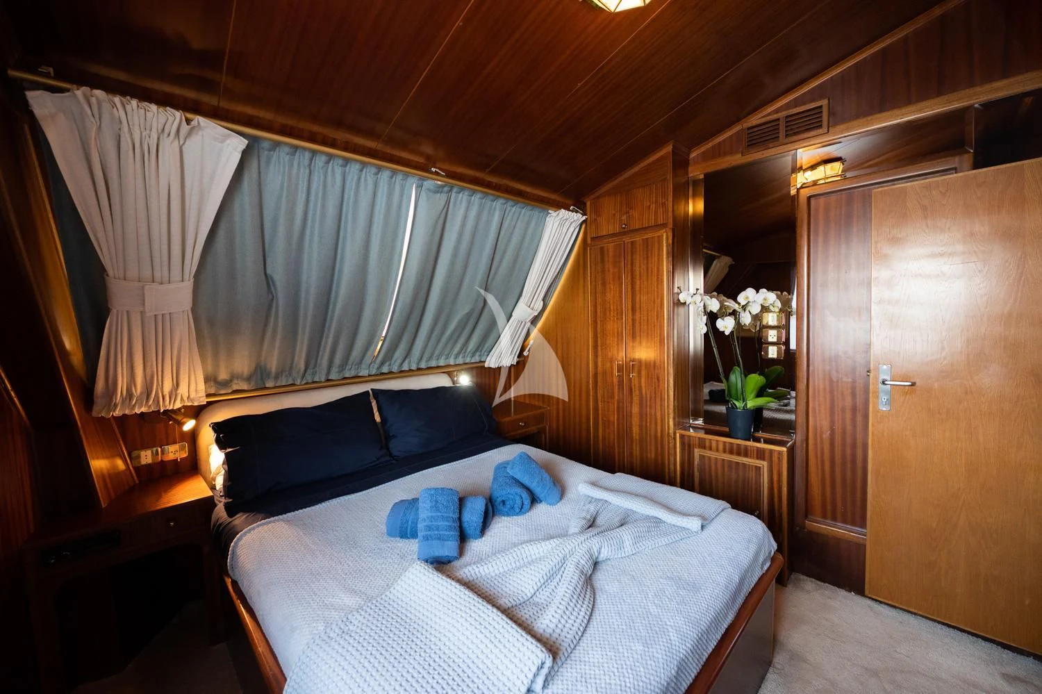 a bed in a room aboard ELENA Yacht for Sale