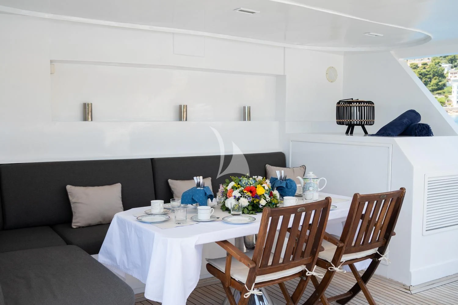 a dining table in a living room aboard ELENA Yacht for Sale