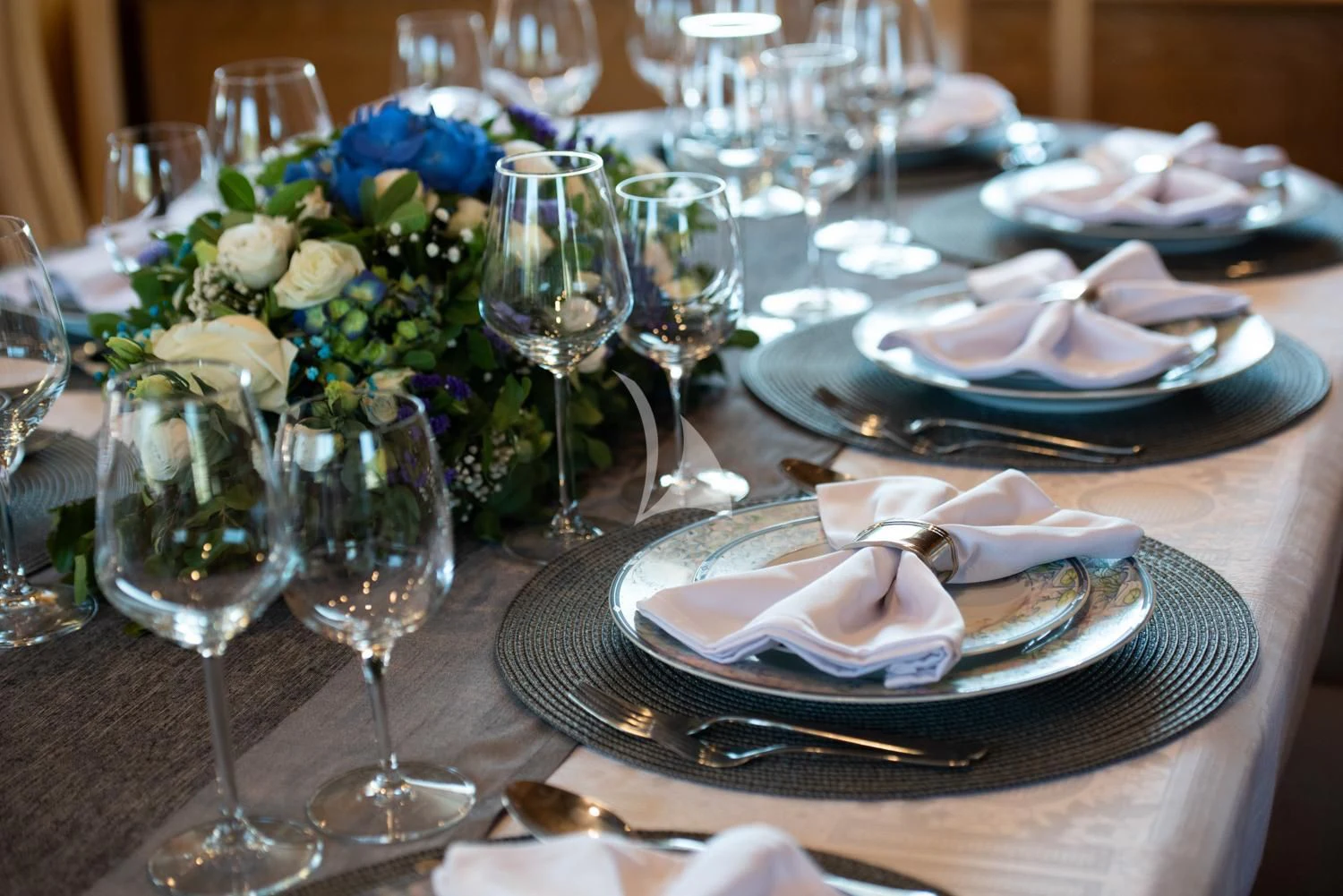 a table with plates and glasses aboard ELENA Yacht for Sale