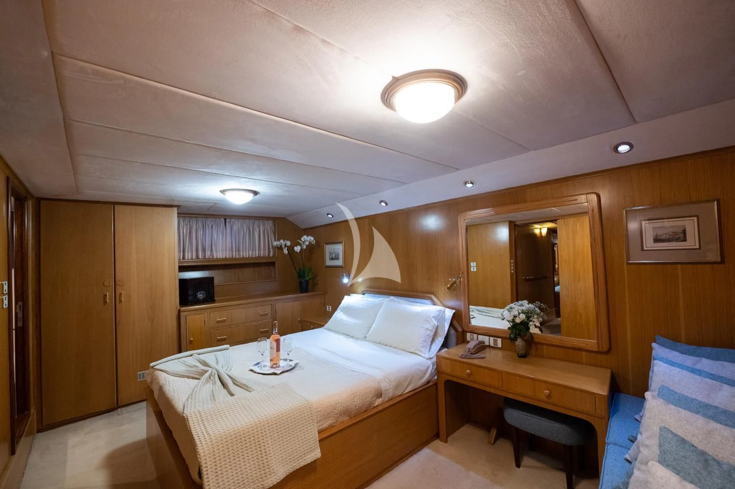 a hotel room with a bed and a desk aboard ELENA Yacht for Sale