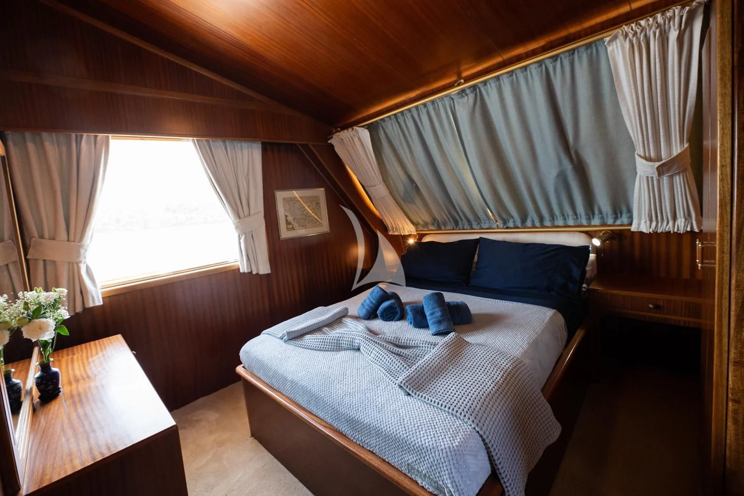 a room with a bed and a table aboard ELENA Yacht for Sale