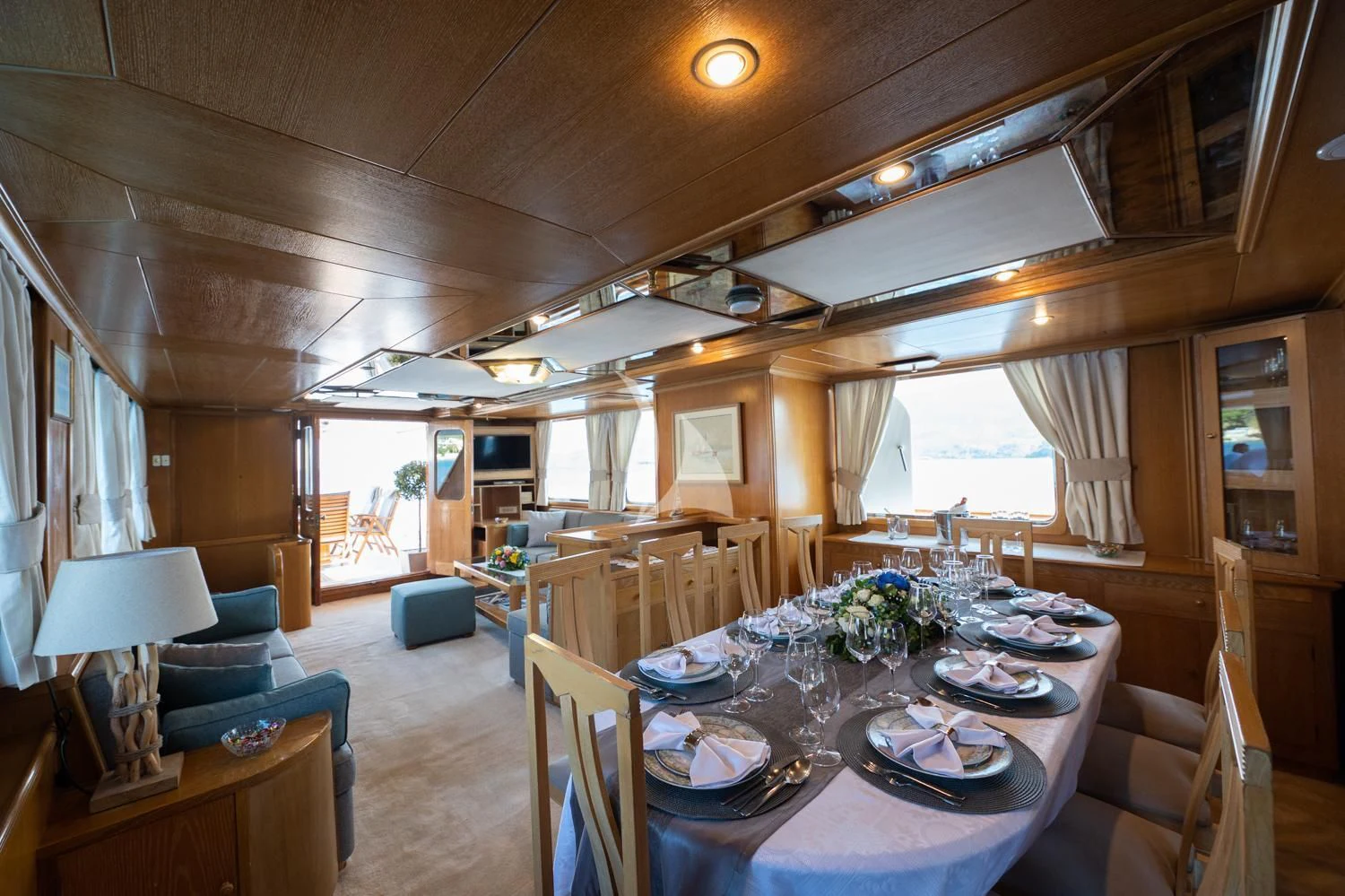 a dining room with a table and chairs aboard ELENA Yacht for Sale