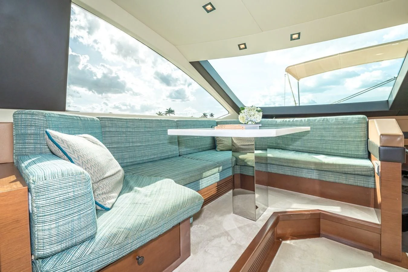 a room with a pool table and chairs aboard LIBERTY BLUE Yacht for Sale