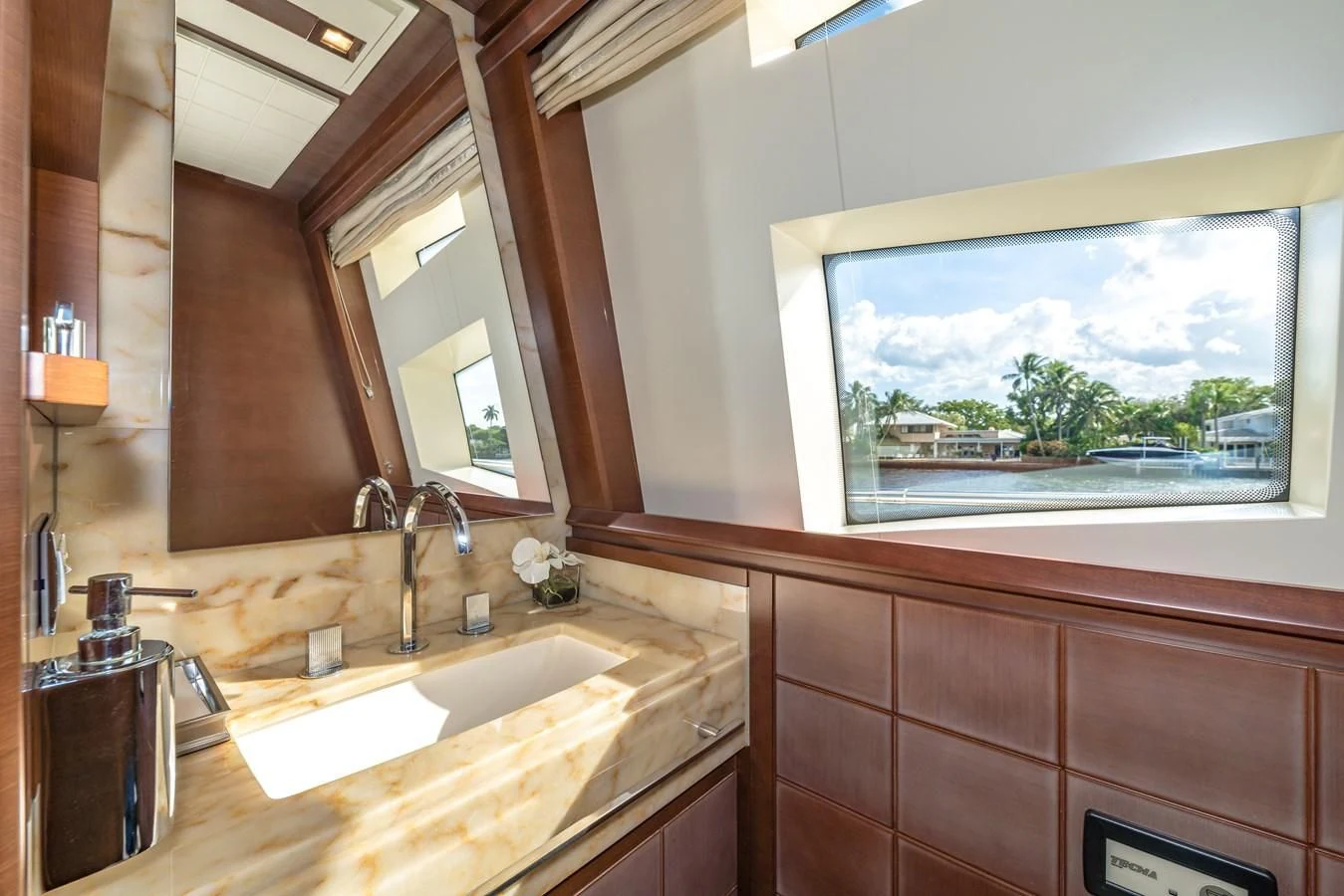 a bathroom with a large window aboard LIBERTY BLUE Yacht for Sale