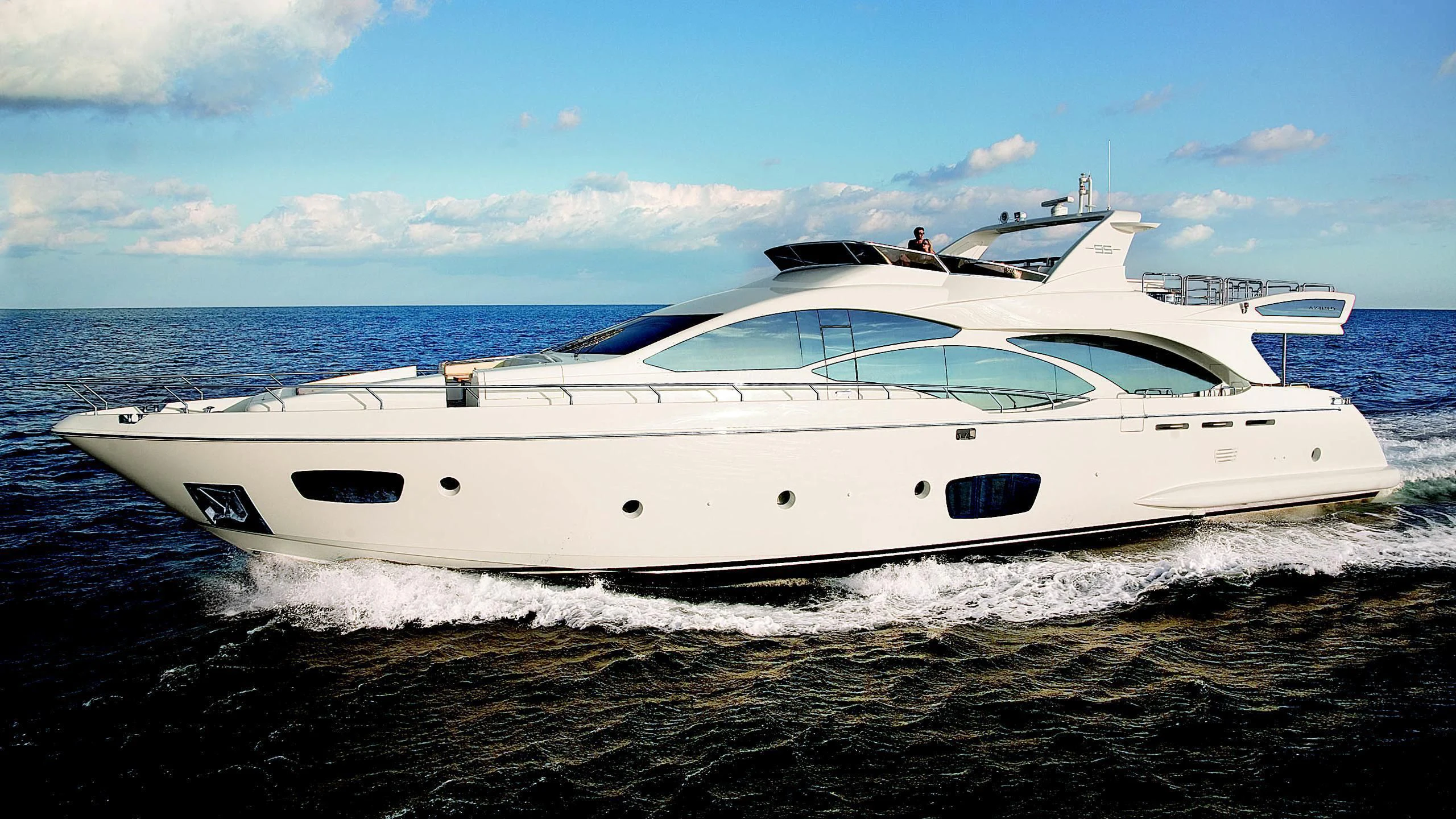 a white yacht on the beach aboard LIBERTY BLUE Yacht for Sale