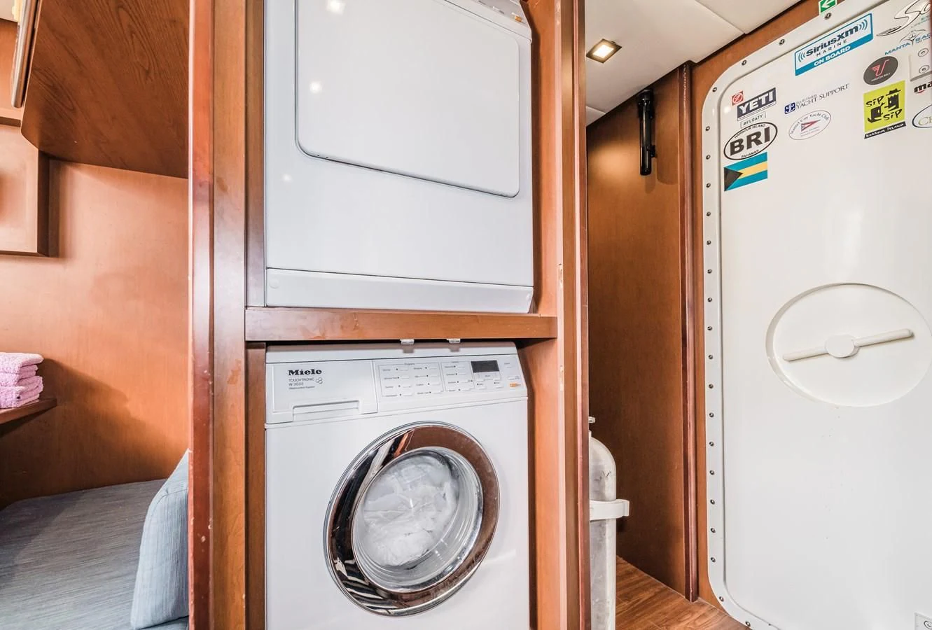 a washing machine in a room aboard LIBERTY BLUE Yacht for Sale