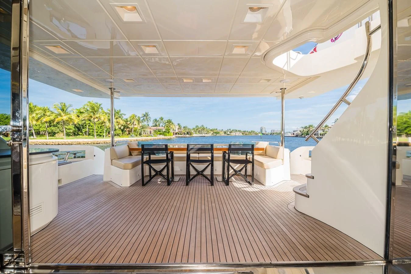 a room with a table and chairs aboard LIBERTY BLUE Yacht for Sale