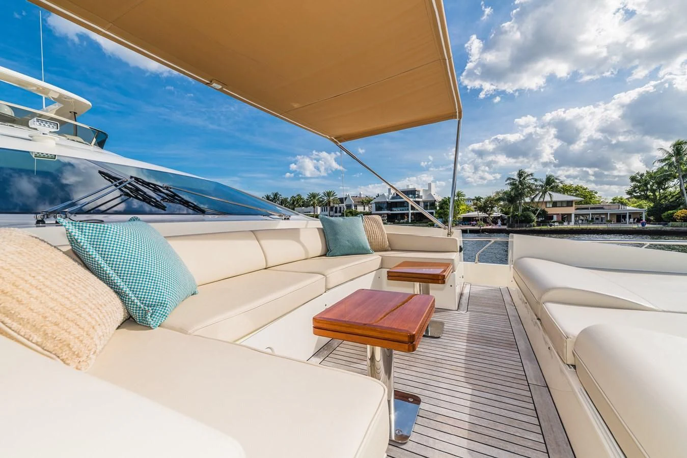 a lounge area with a table and chairs on it aboard LIBERTY BLUE Yacht for Sale