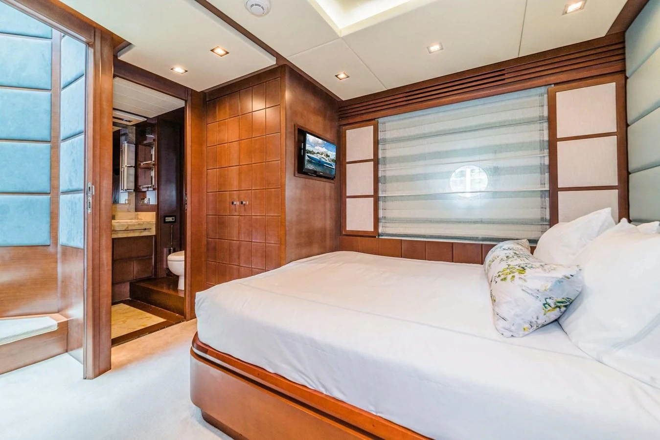 a bedroom with a bed and a closet aboard LIBERTY BLUE Yacht for Sale