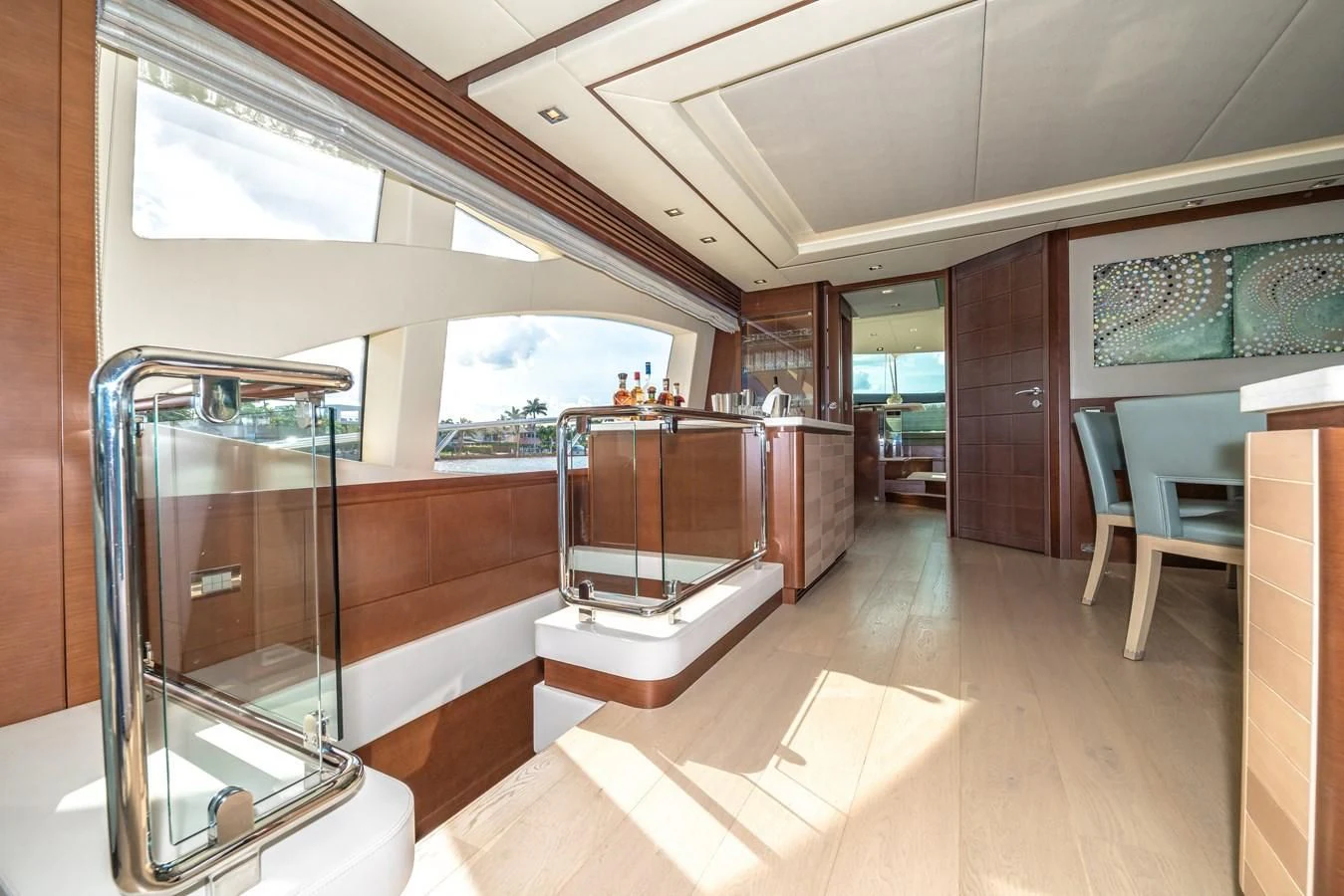 a room with a wood floor and a large window aboard LIBERTY BLUE Yacht for Sale