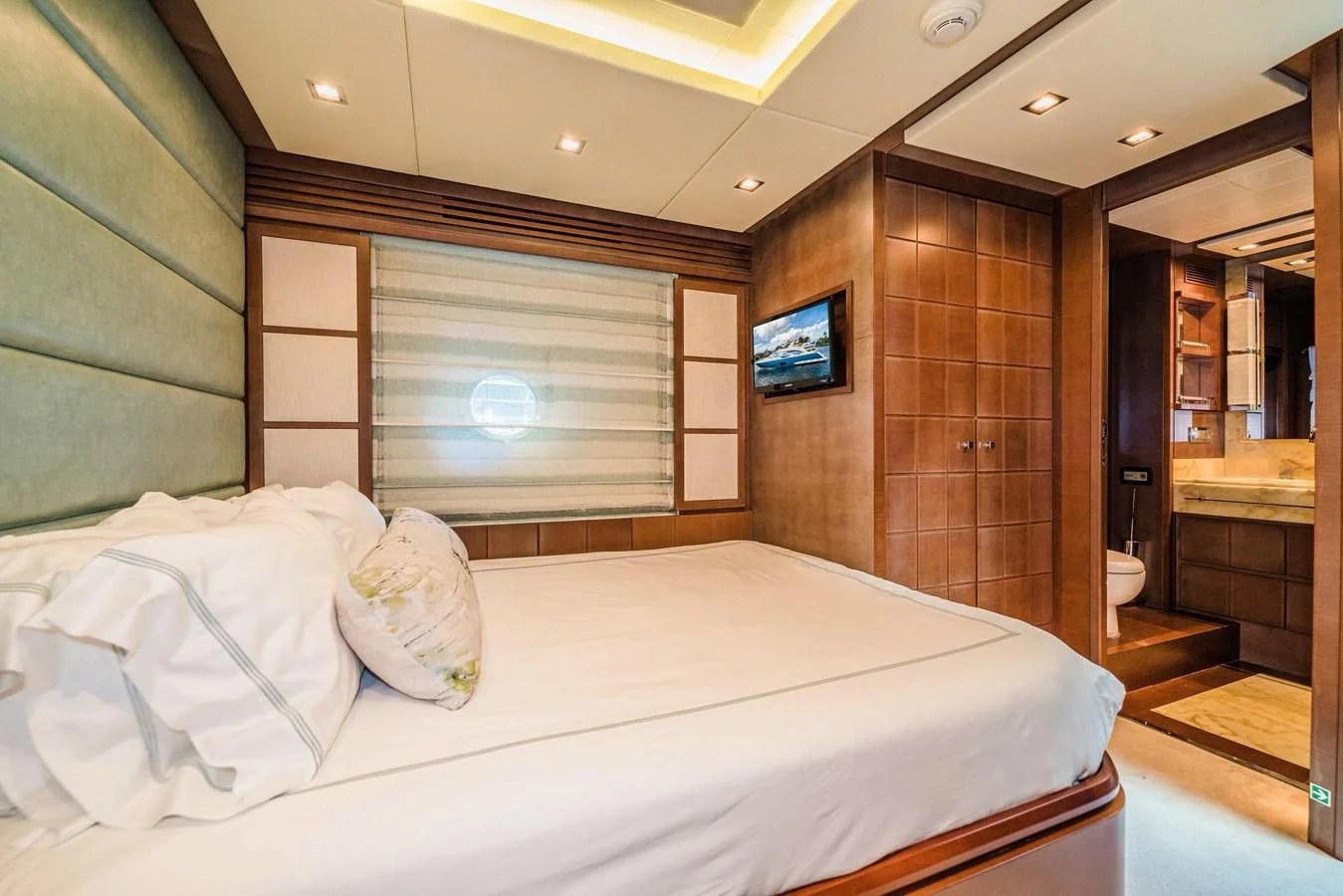 a bed in a room aboard LIBERTY BLUE Yacht for Sale