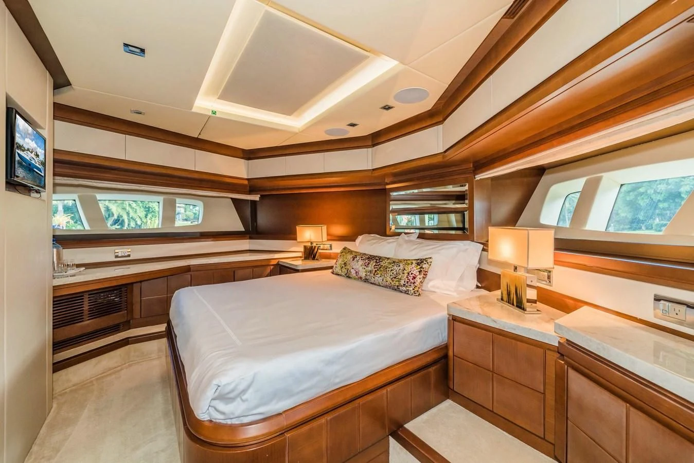 a room with a bed and a desk aboard LIBERTY BLUE Yacht for Sale