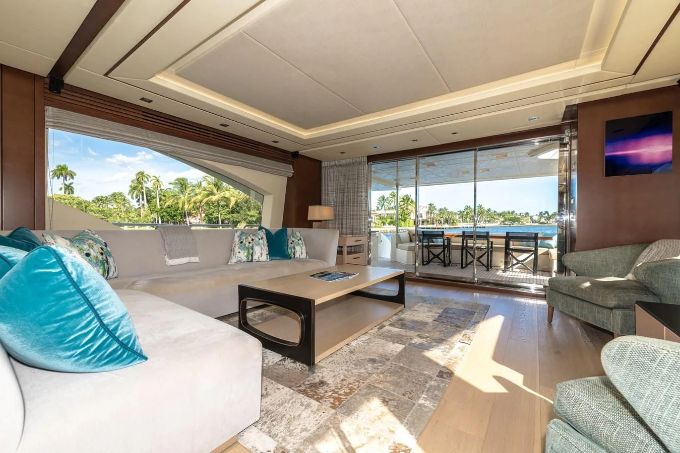 a living room with a large glass window aboard LIBERTY BLUE Yacht for Sale