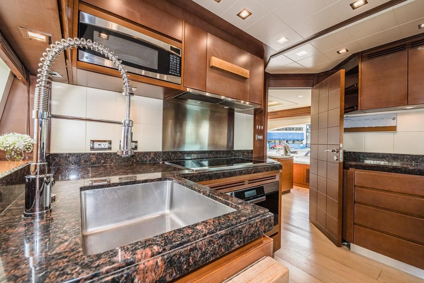 a kitchen with a large island aboard LIBERTY BLUE Yacht for Sale