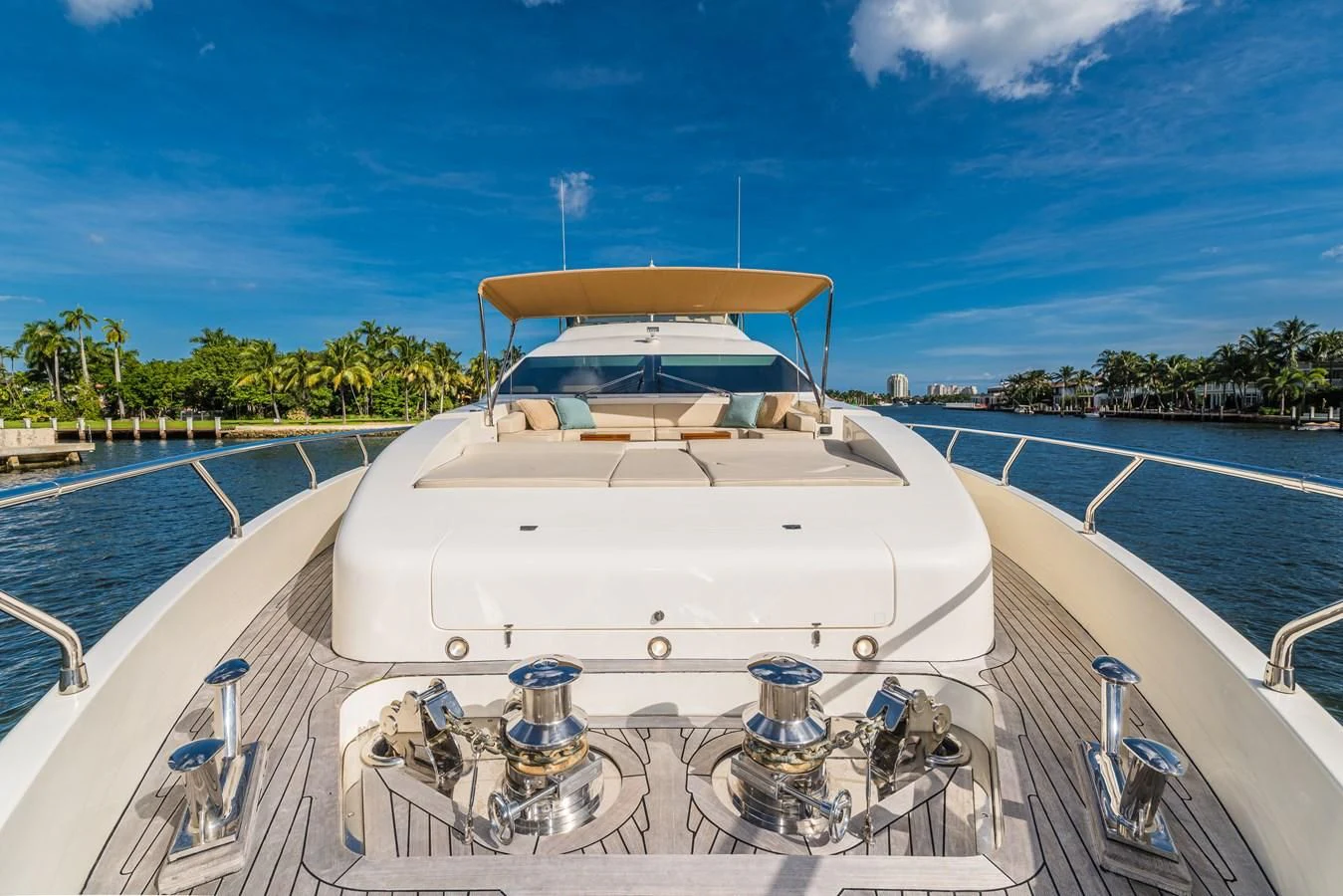 a white boat on a body of water aboard LIBERTY BLUE Yacht for Sale