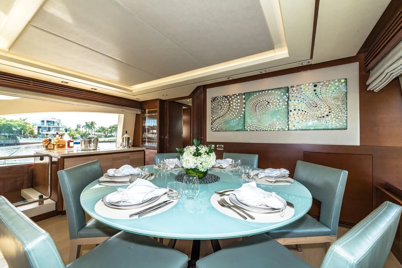 a dining room with a table set aboard LIBERTY BLUE Yacht for Sale
