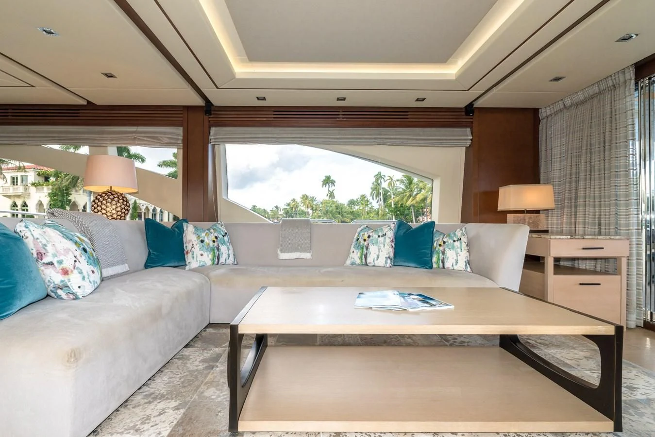 a living room with a couch and a table aboard LIBERTY BLUE Yacht for Sale