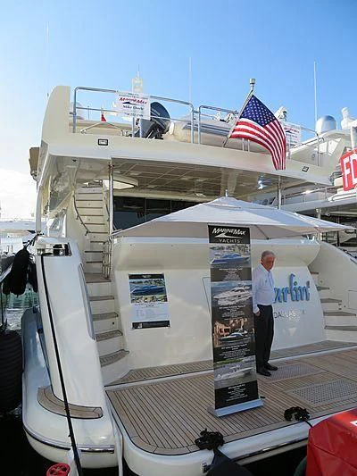 a person standing on a boat aboard LIBERTY BLUE Yacht for Sale