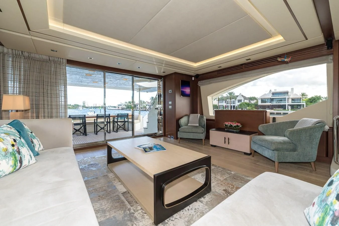 a living room with a large window aboard LIBERTY BLUE Yacht for Sale