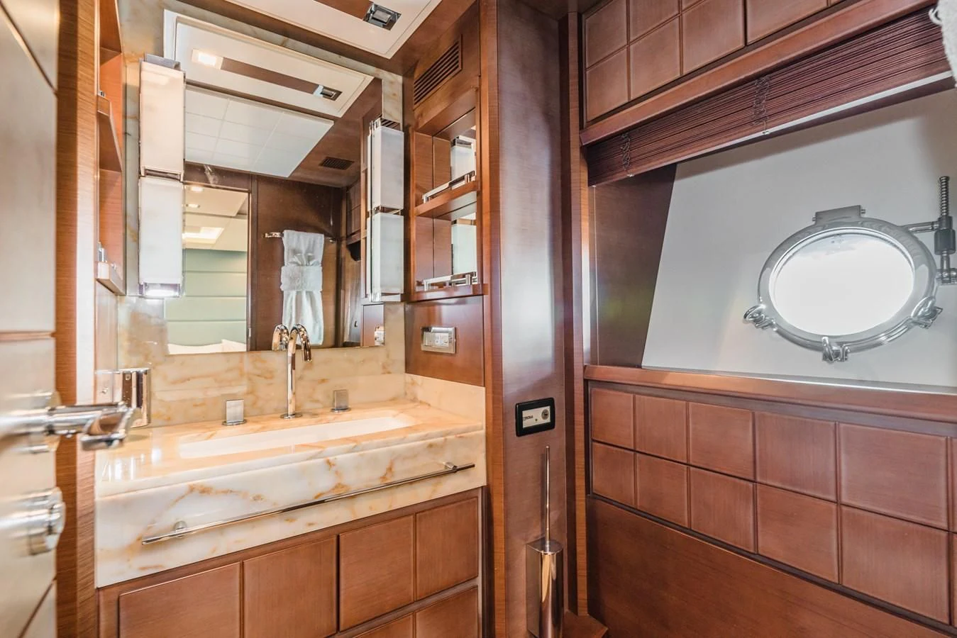 a bathroom with a large mirror aboard LIBERTY BLUE Yacht for Sale