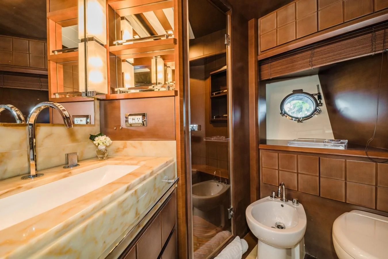 a bathroom with a sink and a mirror aboard LIBERTY BLUE Yacht for Sale