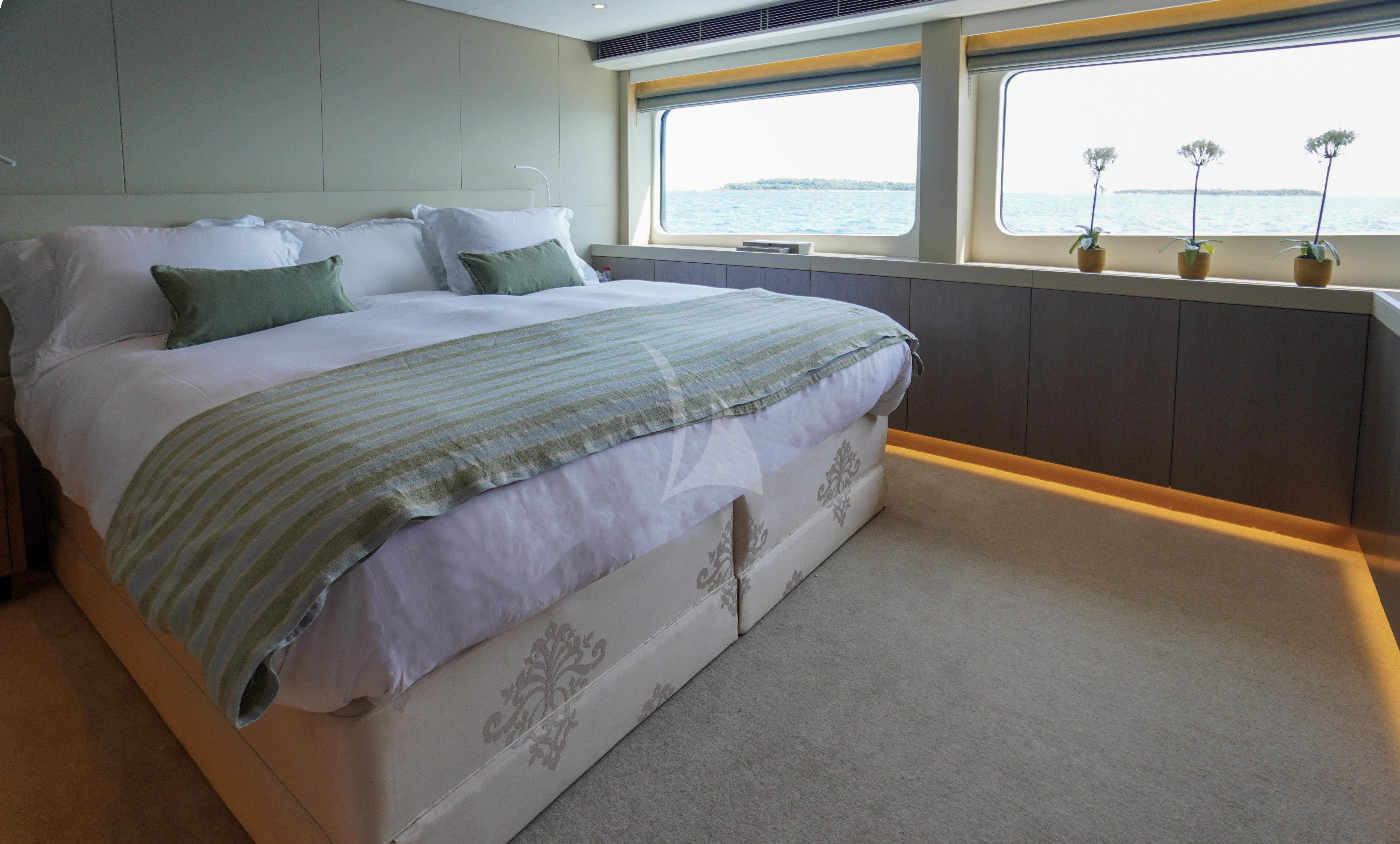 a bed in a room aboard UNEXPECTED Yacht for Sale