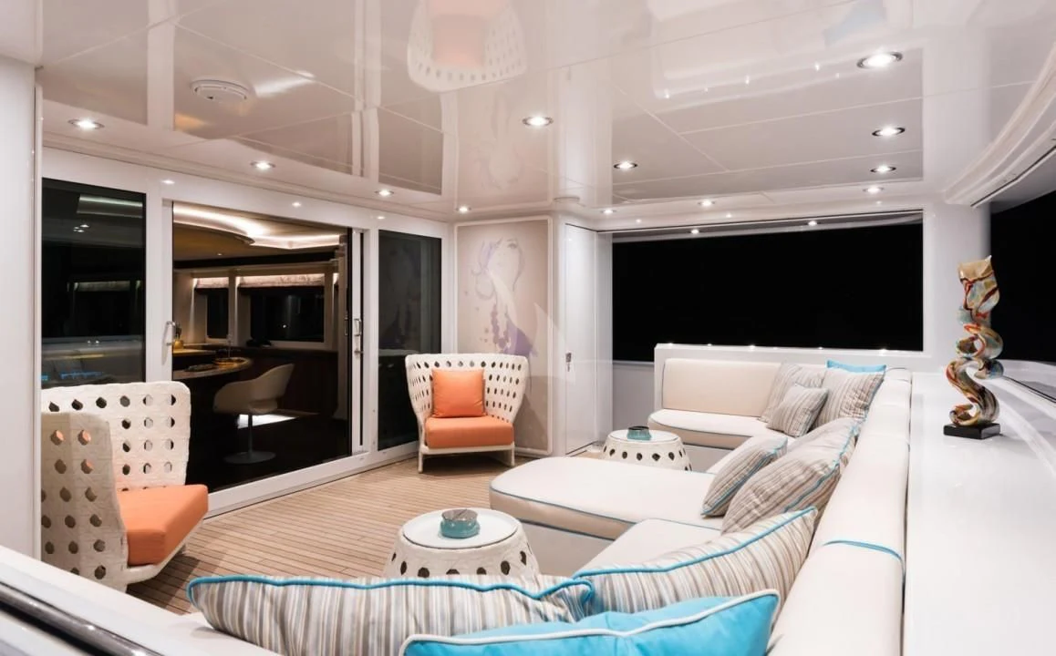 a living room with a large screen aboard UNEXPECTED Yacht for Sale