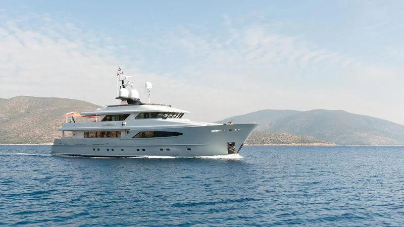 a white yacht in the water aboard UNEXPECTED Yacht for Sale