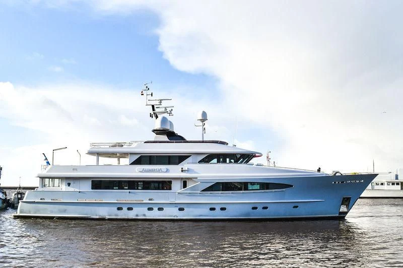 a large white boat in the water aboard UNEXPECTED Yacht for Sale