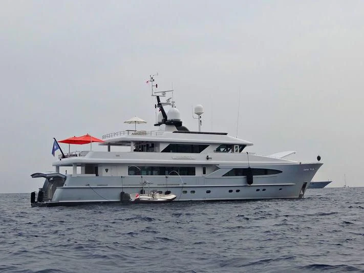 a large white boat in the water aboard UNEXPECTED Yacht for Sale