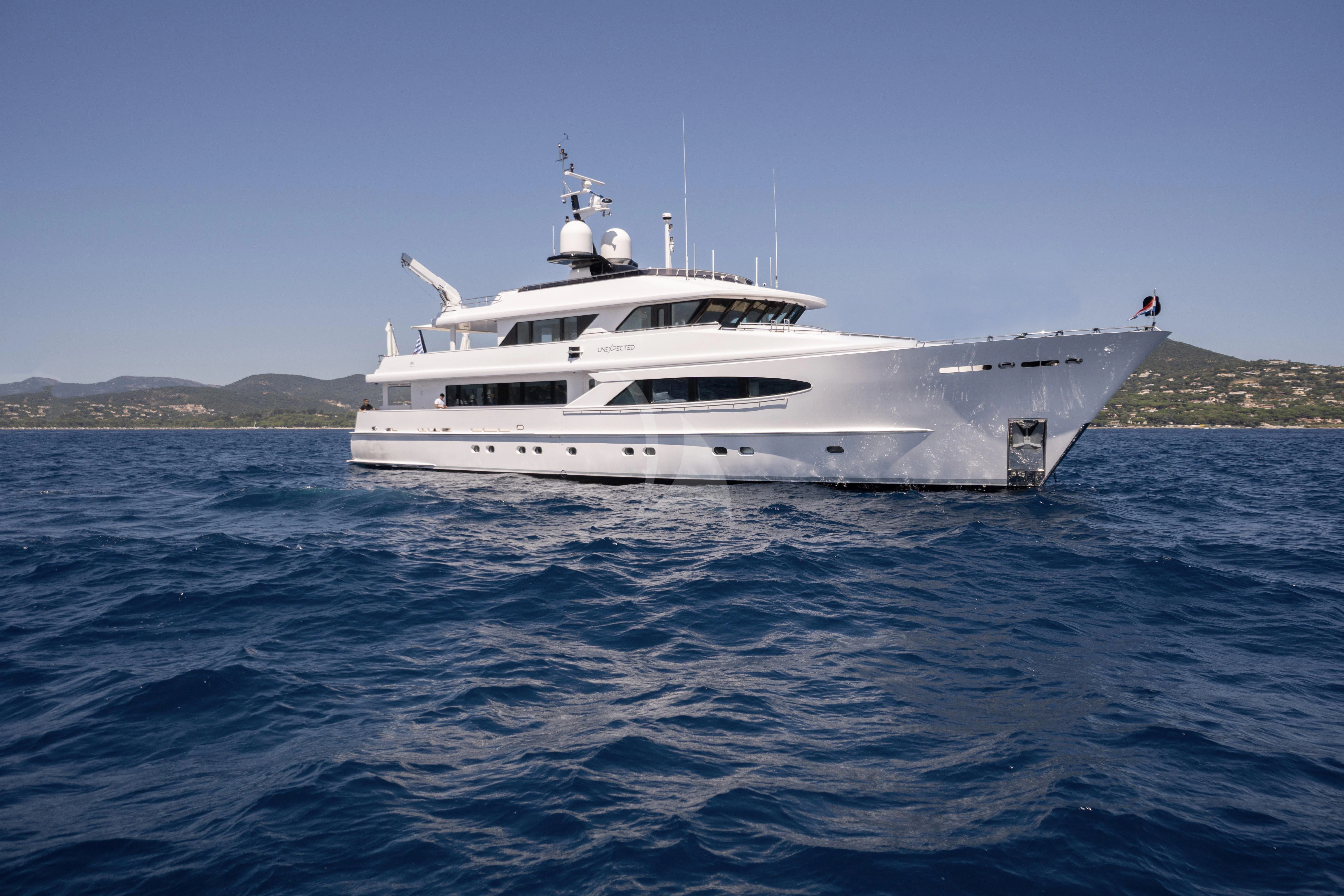 a white boat in the water aboard UNEXPECTED Yacht for Sale