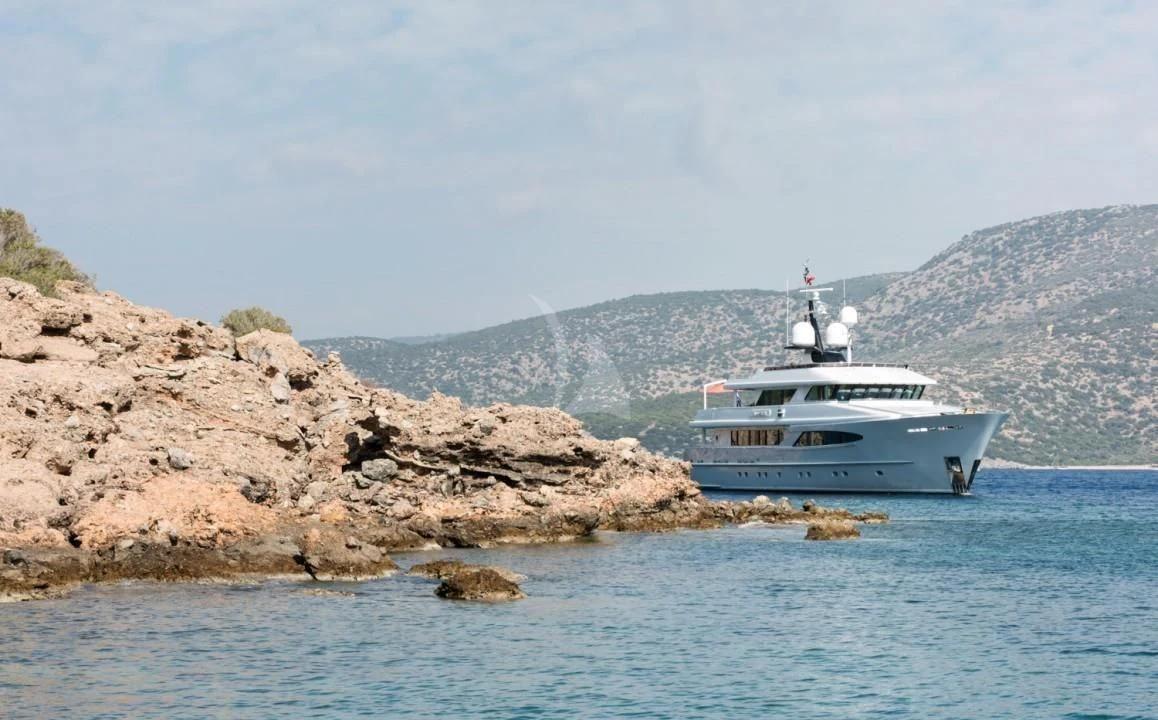 a boat on the water aboard UNEXPECTED Yacht for Sale