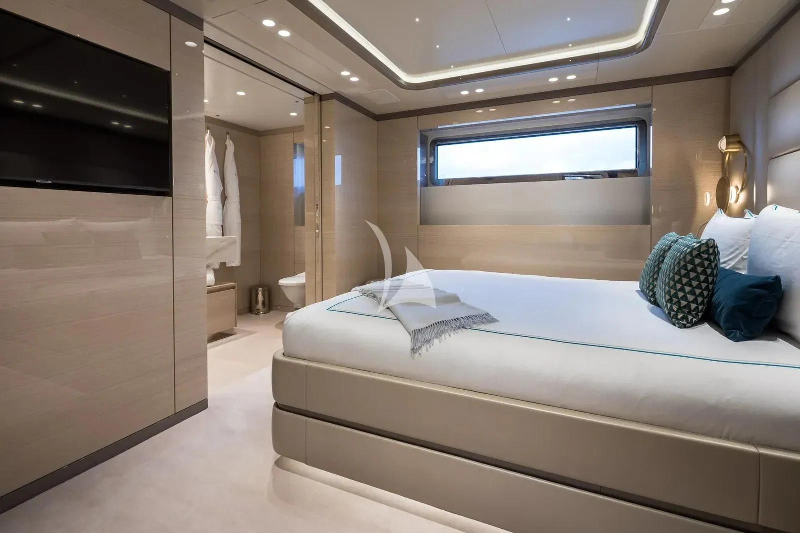 a room with a bed and a television aboard BIRUBI Yacht for Sale