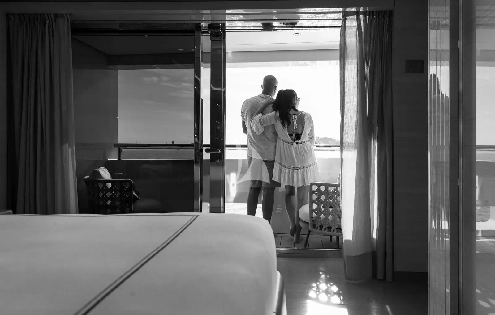 a man and a woman dancing in a room aboard BIRUBI Yacht for Sale