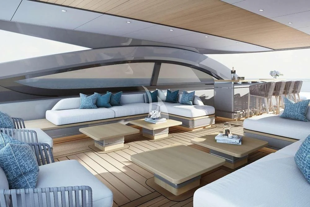 a modern living room with a white couch and a white table aboard BIRUBI Yacht for Sale