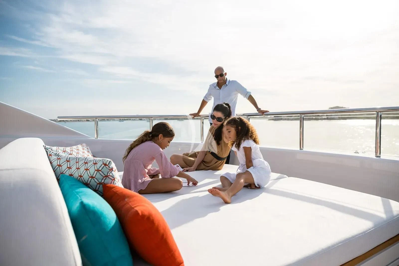 a group of people sitting on a boat aboard BIRUBI Yacht for Sale